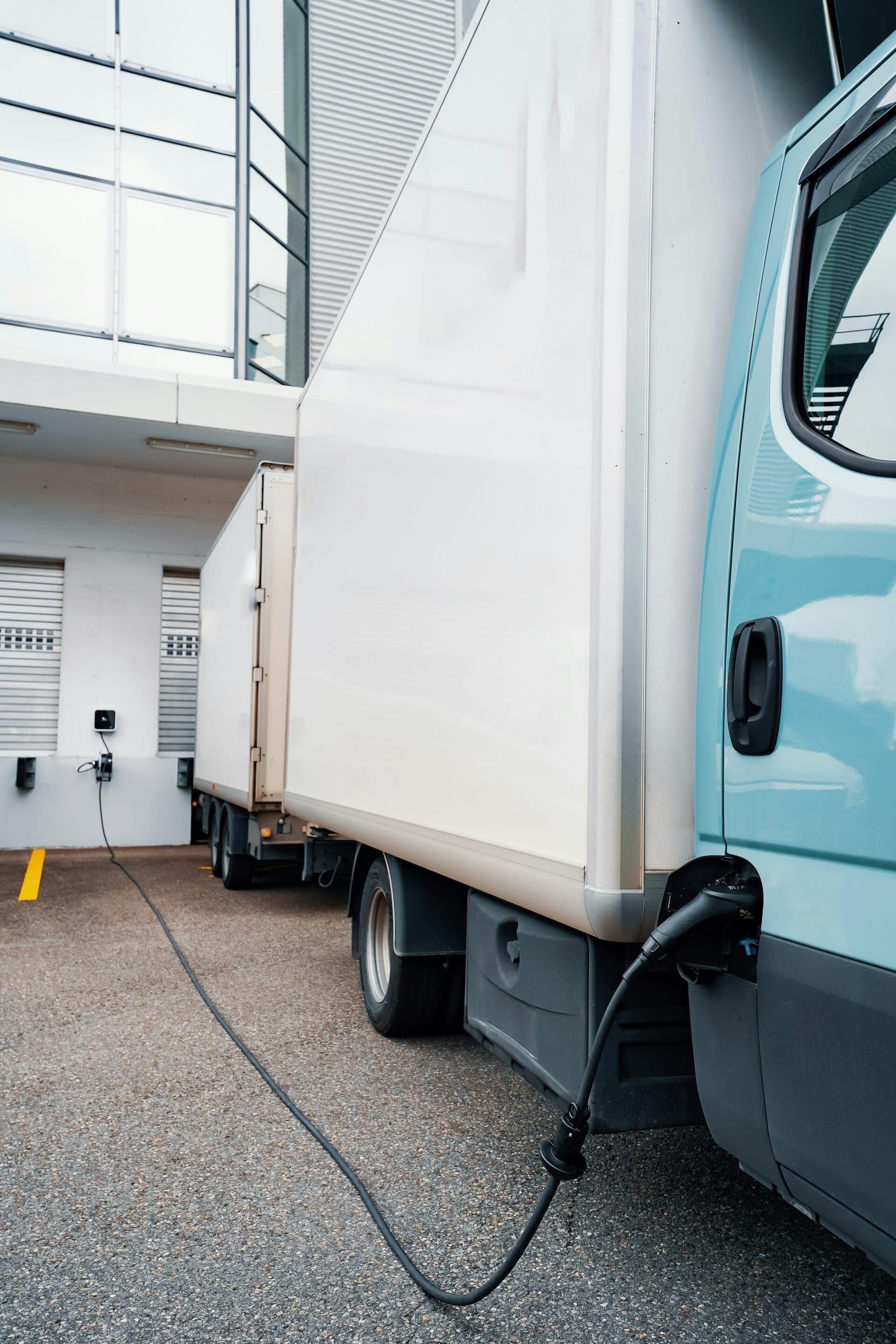 Electric van plugged into a UK commercial charging point